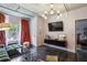 Modern living room featuring an exposed concrete ceiling, sleek black floors, and designer lighting fixture at 800 Peachtree Ne St # 1014, Atlanta, GA 30308