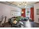 Chic living room featuring a plush green sofa, modern lighting, and exposed ductwork at 800 Peachtree Ne St # 1014, Atlanta, GA 30308