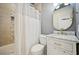 Bathroom featuring white vanity, updated fixtures, and tiled shower/tub combo at 999 Smith Sw St, Atlanta, GA 30310