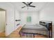Bedroom features wood flooring, ceiling fan, recessed lights and minimalist decor at 999 Smith Sw St, Atlanta, GA 30310