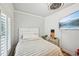 Comfortable bedroom featuring decorative wall, natural light and a modern ceiling fan at 999 Smith Sw St, Atlanta, GA 30310