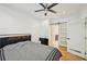 This bedroom features hardwood floors, a ceiling fan, recessed lights, and en suite bathroom at 999 Smith Sw St, Atlanta, GA 30310