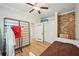 This bedroom features wood floors, a ceiling fan, and closet at 999 Smith Sw St, Atlanta, GA 30310