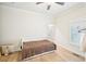 This bedroom features wood floors, a ceiling fan, and white trim at 999 Smith Sw St, Atlanta, GA 30310