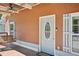 Charming front porch with a welcoming swing and a stylish blue front door at 999 Smith Sw St, Atlanta, GA 30310