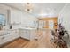 Spacious living area with updated kitchen, wood accent wall, and modern lighting at 999 Smith Sw St, Atlanta, GA 30310