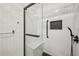 Close up of shower, with white subway tile and a bench seat at 999 Smith Sw St, Atlanta, GA 30310