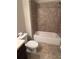 Tile shower-tub combination featuring tile surround, a white tub, and silver shower head at 261 Cole Ne St, Marietta, GA 30060