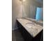 Bathroom features a double sink vanity with granite countertops and a large mirror at 261 Cole Ne St, Marietta, GA 30060