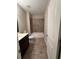 Bathroom with a shower and tub combo, a single sink vanity, and tile flooring at 261 Cole Ne St, Marietta, GA 30060