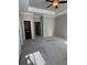 Spacious bedroom with neutral walls and carpet featuring tray ceilings and lots of natural light from the windows at 261 Cole Ne St, Marietta, GA 30060