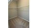 Walk-in closet featuring wire shelving, carpeting and neutral colored walls at 261 Cole Ne St, Marietta, GA 30060