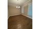 Bright dining room with hardwood floors and a stylish chandelier fixture at 261 Cole Ne St, Marietta, GA 30060