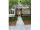 Charming brick townhome with a well-manicured front yard and inviting entrance at 261 Cole Ne St, Marietta, GA 30060