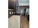 Kitchen with stainless steel appliances, dark backsplash and wooden cabinets at 261 Cole Ne St, Marietta, GA 30060