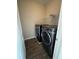 Laundry room featuring a washer and dryer with vinyl plank flooring at 261 Cole Ne St, Marietta, GA 30060