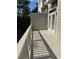 Exterior patio area shows the wooden deck, railing and siding on a sunny day at 261 Cole Ne St, Marietta, GA 30060