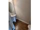 Clean powder room featuring pedestal sink, hardwood floors and fixtures at 261 Cole Ne St, Marietta, GA 30060