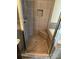 Close up of the tiled shower stall featuring bench, shower head, and built-in niche at 261 Cole Ne St, Marietta, GA 30060
