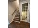Staircase featuring hardwood steps and a white door leading to another room at 261 Cole Ne St, Marietta, GA 30060
