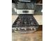 Close up of a modern, stainless steel stove in a kitchen at 261 Cole Ne St, Marietta, GA 30060