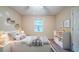 Stylized bedroom featuring large window, bed, and dresser at 5310 Arrowind Nw Rd, Lilburn, GA 30047