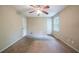 Simple bedroom with carpet flooring, neutral walls and a window at 5310 Arrowind Nw Rd, Lilburn, GA 30047