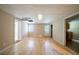 Spacious bonus room featuring hardwood floors, natural light and entry to the kitchen at 5310 Arrowind Nw Rd, Lilburn, GA 30047