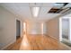 Spacious bonus room with hardwood floors and entry to other rooms at 5310 Arrowind Nw Rd, Lilburn, GA 30047
