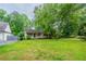 Charming single-story home with a welcoming front porch and a well-manicured lawn at 5310 Arrowind Nw Rd, Lilburn, GA 30047
