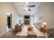 Bright living room with vaulted ceilings, a fireplace, and modern furnishings at 5310 Arrowind Nw Rd, Lilburn, GA 30047