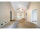 Open living room with high ceilings, railing and access to other rooms at 5310 Arrowind Nw Rd, Lilburn, GA 30047