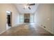 Open living room with a stone fireplace and access to the kitchen at 5310 Arrowind Nw Rd, Lilburn, GA 30047
