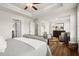 Large bedroom featuring hardwood flooring, recessed lighting, and a sitting area at 934 Elwood St, Dacula, GA 30019