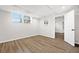 Spacious basement with wood flooring and a window for natural light at 1415 Dalewood Ne Dr, Atlanta, GA 30329