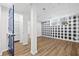 Finished basement boasts stylish buffalo check wallpaper and vinyl floors at 1415 Dalewood Ne Dr, Atlanta, GA 30329