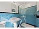 Updated bathroom featuring a shower with blue subway tile and black trim at 1415 Dalewood Ne Dr, Atlanta, GA 30329