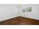 Bedroom features hardwood floors, white walls and modern chandelier lighting at 1415 Dalewood Ne Dr, Atlanta, GA 30329