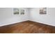 Bedroom with two bright windows, hardwood floors and neutral paint at 1415 Dalewood Ne Dr, Atlanta, GA 30329