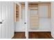 Open closet with custom shelving and drawers for optimal organization at 1415 Dalewood Ne Dr, Atlanta, GA 30329