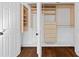 Bedroom closet featuring customized shelving and drawers for optimal organization at 1415 Dalewood Ne Dr, Atlanta, GA 30329