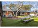 Outdoor courtyard area, with seating and picnic tables on artificial turf at 1415 Dalewood Ne Dr, Atlanta, GA 30329