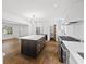 Bright kitchen features large center island, stainless steel appliances, and hardwood floors at 1415 Dalewood Ne Dr, Atlanta, GA 30329