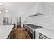 Bright kitchen features stainless steel appliances, white subway tile backsplash, and hardwood floors at 1415 Dalewood Ne Dr, Atlanta, GA 30329