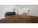 Open kitchen featuring a center island, wooden floors and access to a living space at 1415 Dalewood Ne Dr, Atlanta, GA 30329