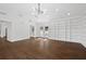 Living room with wood floors, modern lighting, and a built-in bookcase against the wall at 1415 Dalewood Ne Dr, Atlanta, GA 30329