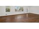 Spacious room features hardwood floors, large windows, and white walls at 1415 Dalewood Ne Dr, Atlanta, GA 30329