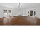 Bright living room with wood floors, modern lighting, and built-in shelving units at 1415 Dalewood Ne Dr, Atlanta, GA 30329