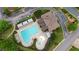 Community swimming pool with multiple sun umbrellas, a splash pad, green space, and lounge chairs at 1805 Hunters Moon Dr, Alpharetta, GA 30005