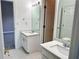Bathroom featuring double vanity, tile floor, and light sconces at 1805 Hunters Moon Dr, Alpharetta, GA 30005